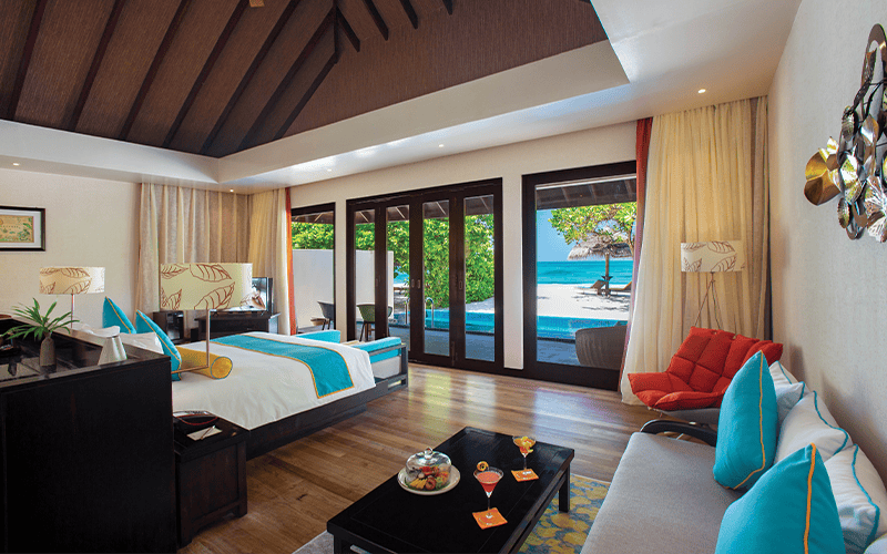 atmosphere kanifushi maldives sunset pool villa interior with view v2