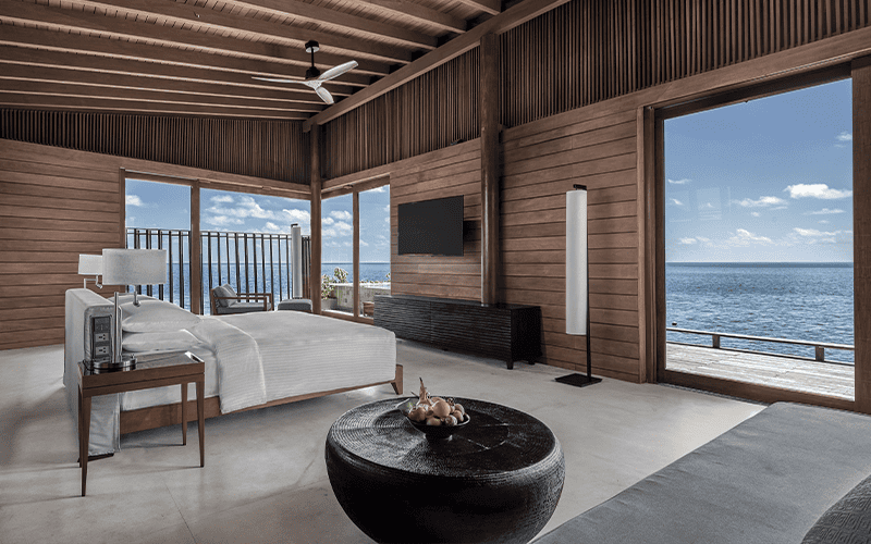 overwater sunset pool villa interior compressed