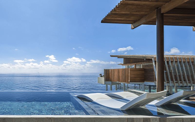overwater sunset pool villa pool compressed