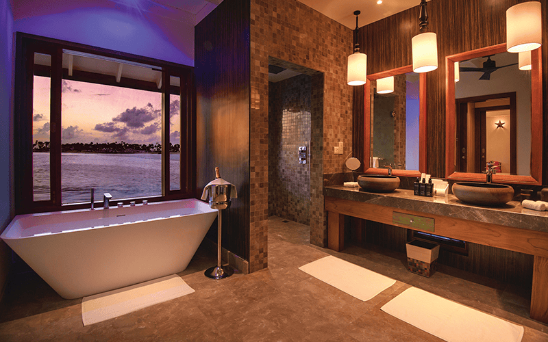 oblu select sangeli villas water villa bathroom at sunset 07 2018 compressed