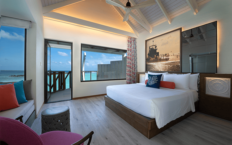 oblu xperience ailafushi water villa bedroom with view compressed