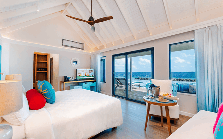 onhs honeymoon sunset water villa with pool bedroom interior 1 compressed