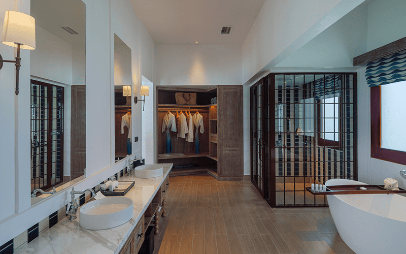 saii lagoon maldives curio collection by hilton two bedroom overwater pool villa bathroom v2