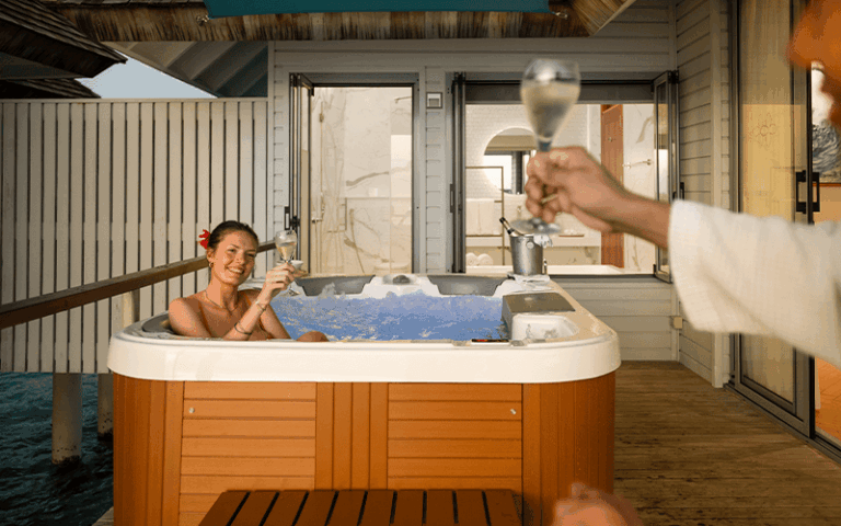 outrigger maldives maafushivaru resort sunset over water villa with hot tub6 compressed