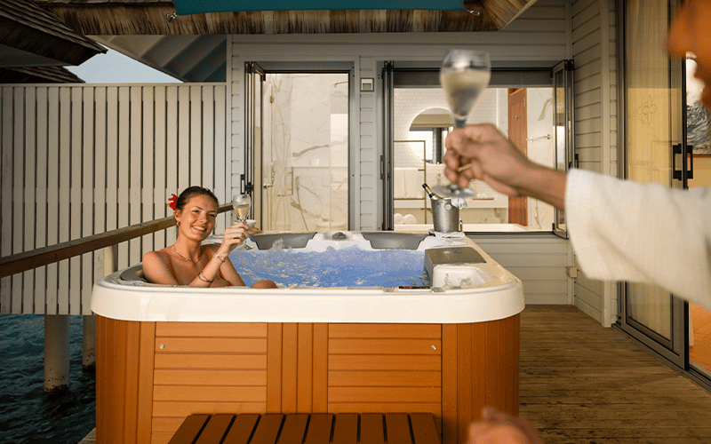 outrigger maldives maafushivaru resort sunset over water villa with hot tub6 compressed